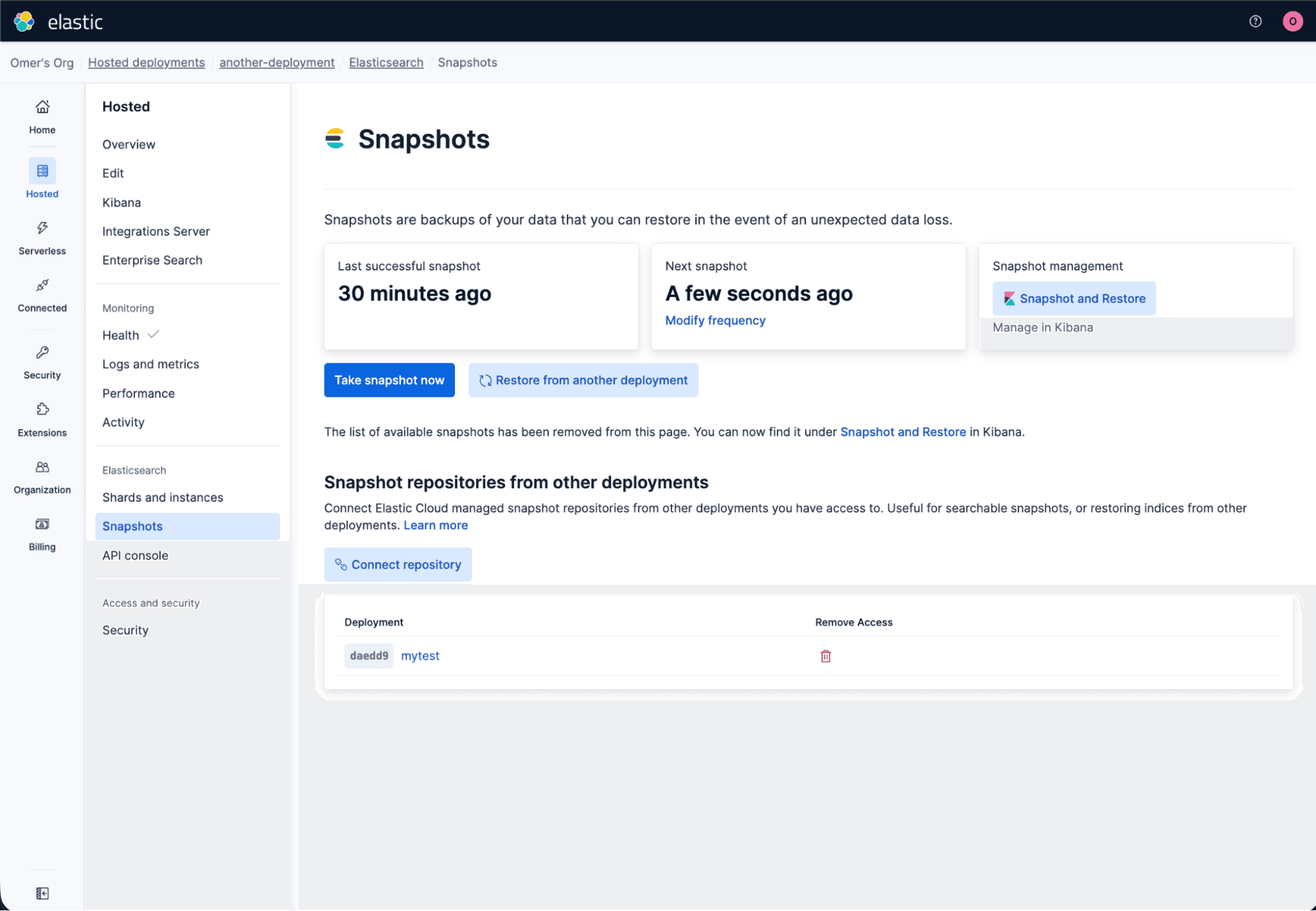 Elastic Cloud dashboard showing the Snapshots page under Elasticsearch. The interface lists snapshot timing details, management options, and repository connections. Buttons for taking and restoring snapshots are visible, along with a table showing one connected deployment labeled “mytest.”